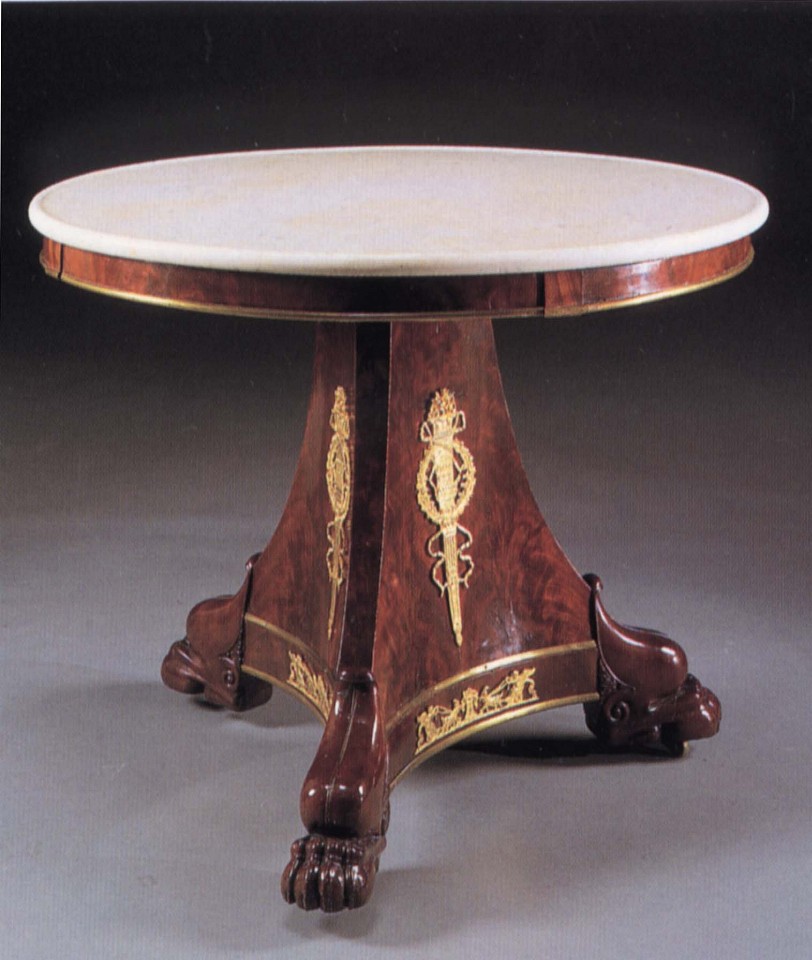 19th Century FRENCH ,   Late Empire Ormolu-Mounted Mahogany Center Table  ,  1810-1815  
  Mahogany ,  30 x 38 1/8 x 38 1/4 in. (76.2 x 96.8 x 97.2 cm)  
  Circular white mottled marble top above the plain frieze fitted with later brass border raised on a canted tripartite support fitted with ormolu flaming torches within a laurel wreath on paw feet.  
  FRE-003-FU  
   Appraisal Value : $0.00 
 Location : $0.00 
 User3 : $0.00